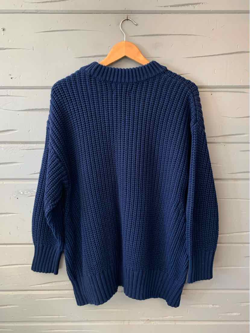 Navy blue rib-knit sweater with a crew neck, long sleeves, and a relaxed fit.