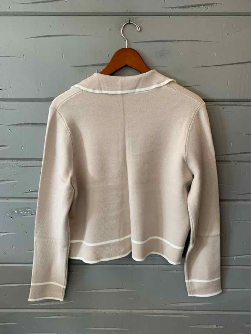 Women’s beige Tahari sweater with a crew neckline, long sleeves, and white trim at the cuffs and hem.