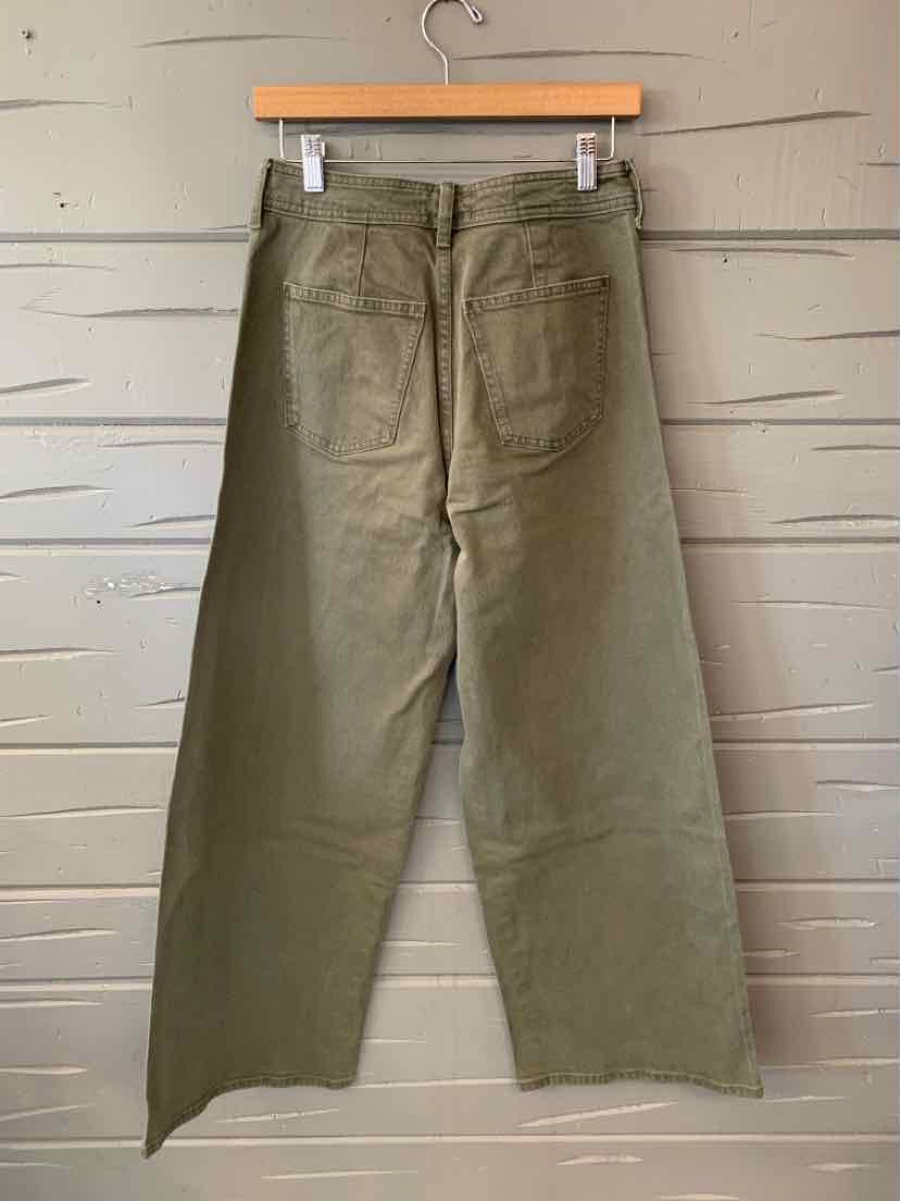 Olive green women's solid pants with straight wide legs and a front fly, clipped to a hanger.