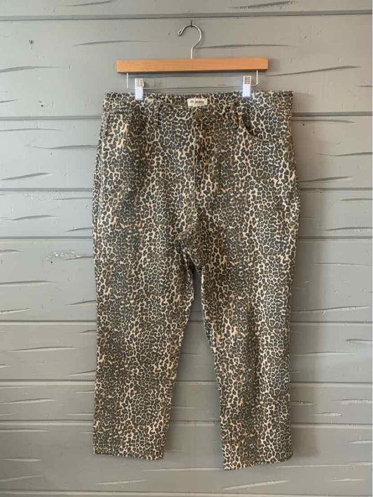 Cropped leopard print jeans in beige and brown with button and zipper closure.