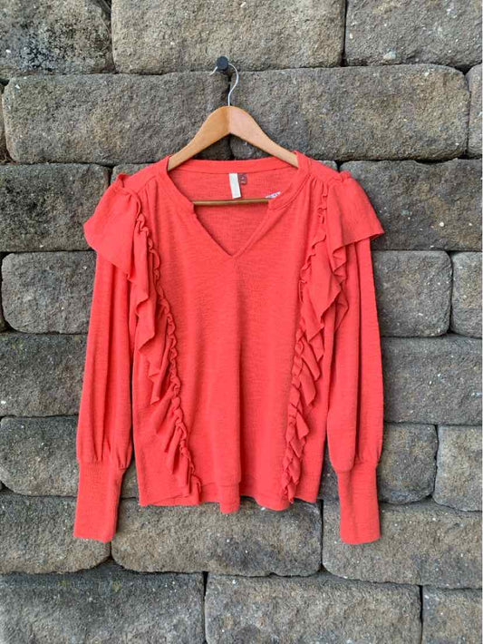 Coral pink long-sleeve sweater with ruffle details along the V-neck and sleeves, size XS.