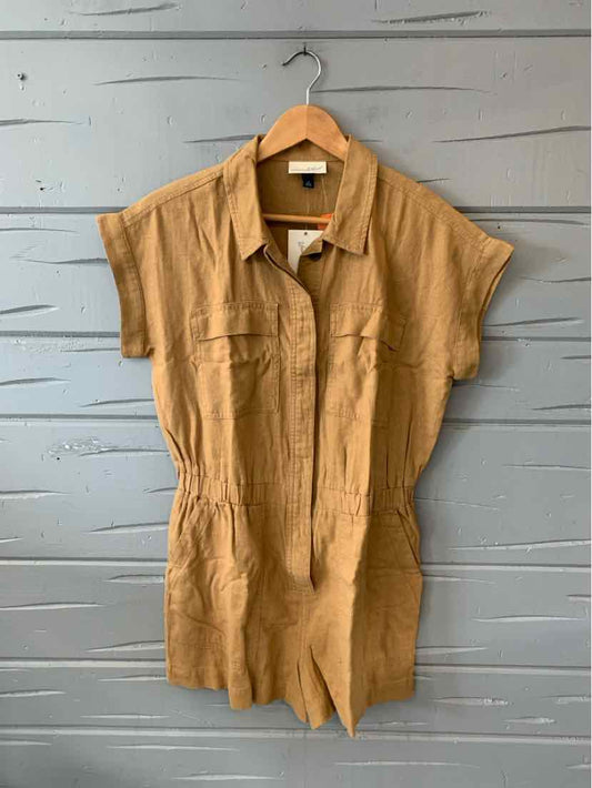 Tan short-sleeve button-up shirt dress with collared neckline and chest pockets.