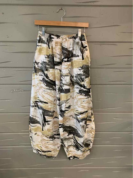 Multi-color abstract patterned pants with elastic cuffs, button waist, and front pockets, size small.