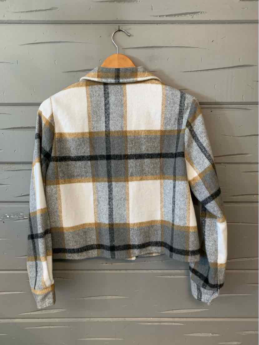 Gray and white plaid flannel shirt with mustard yellow accents, long sleeves, and buttoned cuffs.