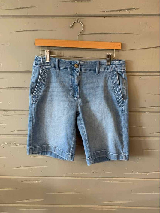 Light blue denim shorts with front pockets, button, and zipper closure, knee-length design.