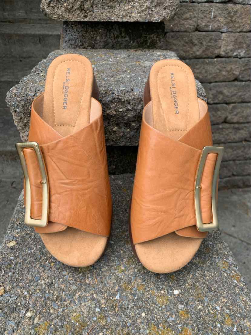 Tan leather slide sandals with gold rectangular buckle, open toe, cushioned footbed, size 8.5.
