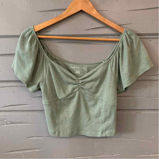 Sage green short puff sleeve crop top with sweetheart neckline and ruched detailing.