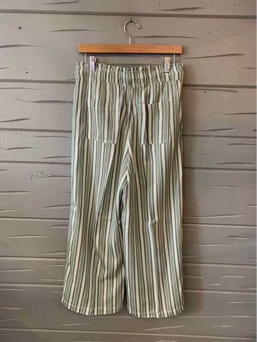 Light gray wide-leg pants with vertical white stripes and an elastic waistband.