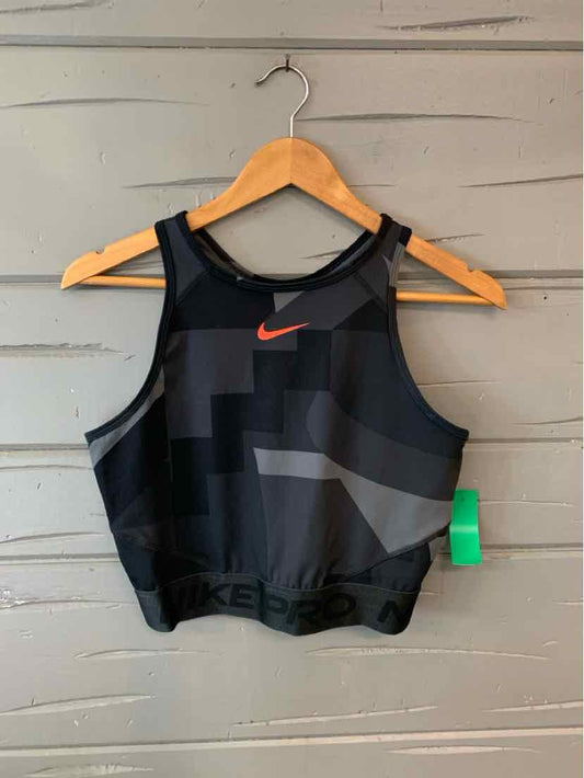 Black and dark gray color block Nike sports bra with red swoosh logo and mesh accents.
