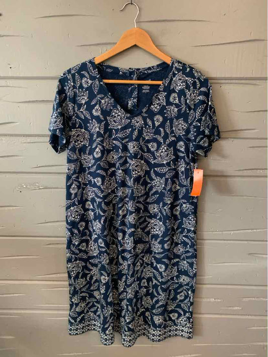 Navy blue floral short-sleeve dress with V-neck and knee-length hem on wooden hanger.