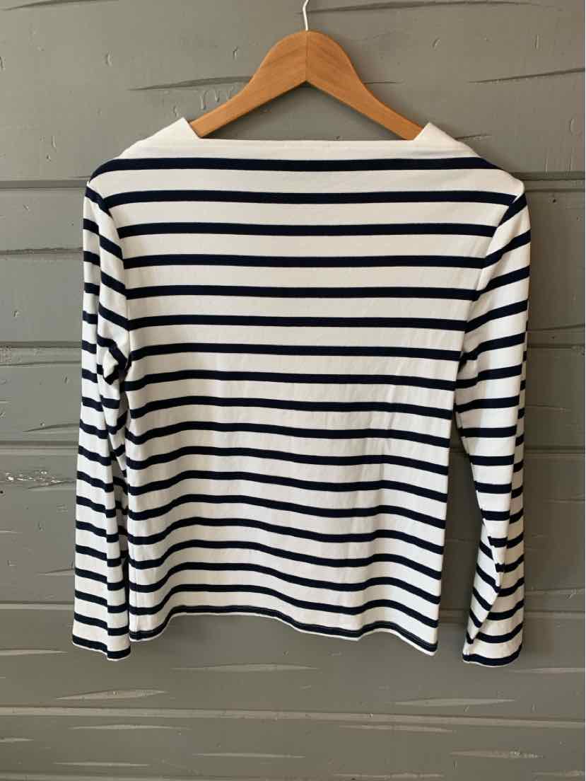 White long-sleeve shirt with navy horizontal stripes and a boat neckline hanging on a wooden hanger.