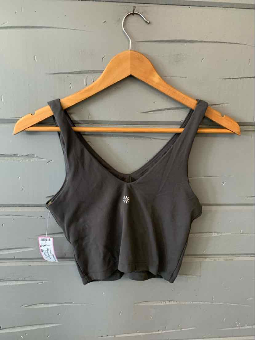 Charcoal gray cropped athletic tank top with wide shoulder straps and scoop neckline on wooden hanger.