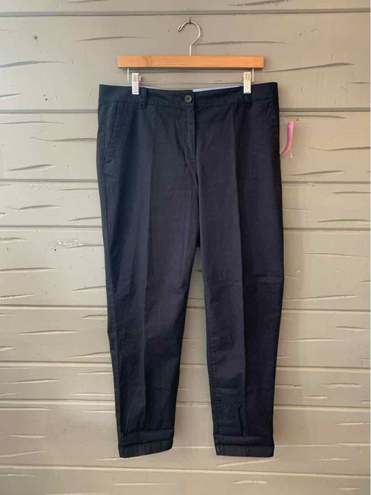 Black tailored ankle-length pants with front zipper and belt loops, size 10.