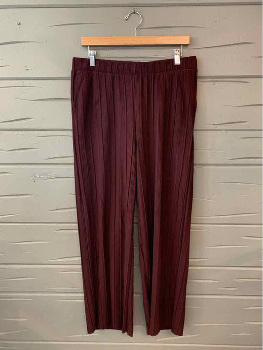 Dark burgundy wide-leg pants with elastic waistband, lightweight textured fabric.