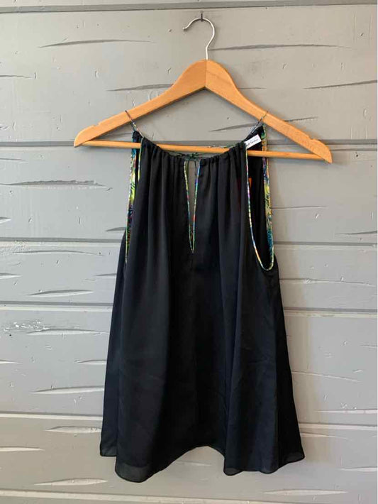 Black silk sleeveless blouse with a multicolored patterned collar and front tie on a wooden hanger.