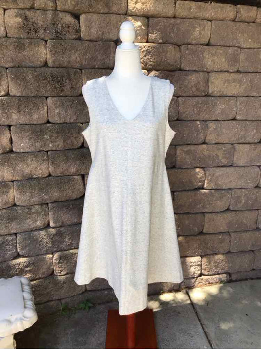 Light gray sleeveless A-line dress with a scoop neckline in soft knit fabric.