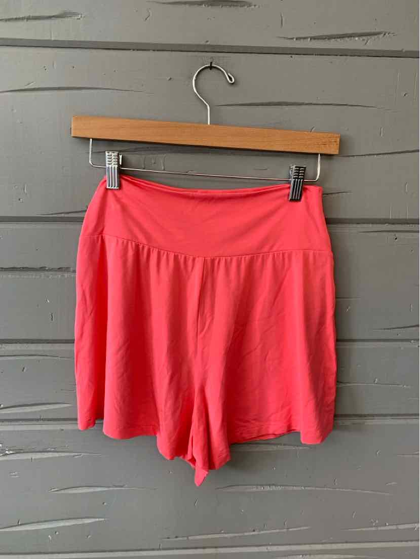 Coral pink high-waisted athletic shorts with wide waistband, soft fabric, size XS.