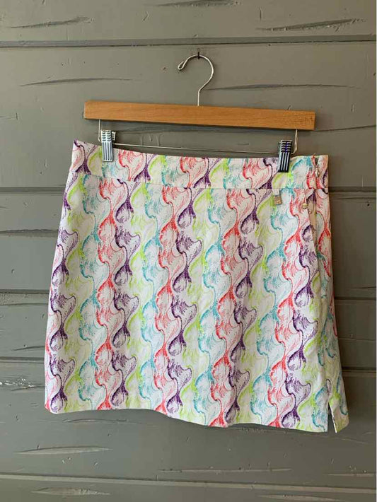 Multicolored patterned Cutter & Buck skirt with wave-like design in size 6 hanging on wooden hanger.