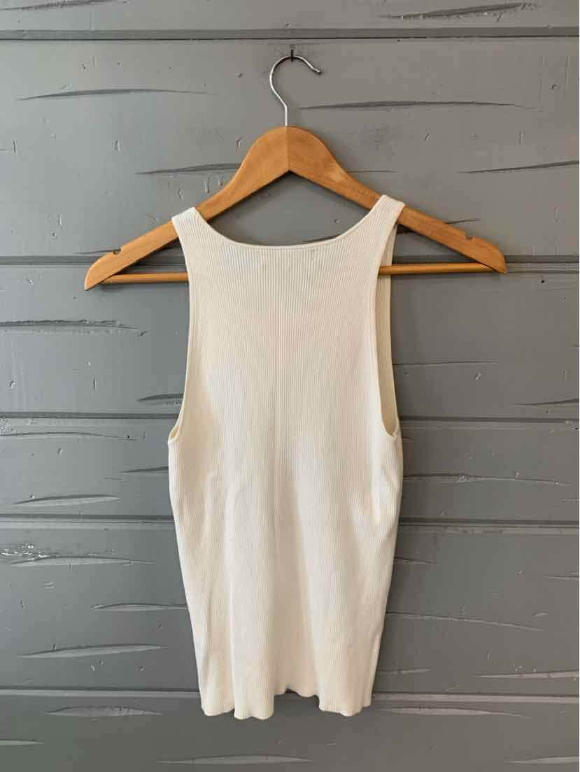 White sleeveless ribbed tank top with scoop neckline hanging on wooden hanger.