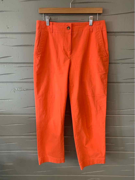 Coral straight-leg pants with front button and zip closure, side pockets, and belt loops.