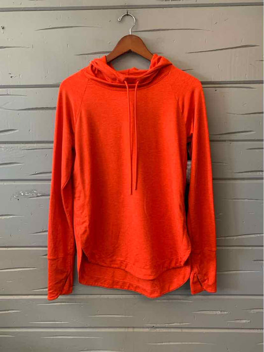 Bright red lightweight pullover hoodie with long sleeves and a drawstring hood hanging on a wooden hanger.
