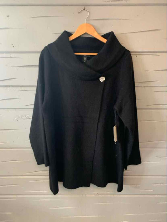 Black long-sleeve cardigan with asymmetrical front, shawl collar, and decorative button detail.