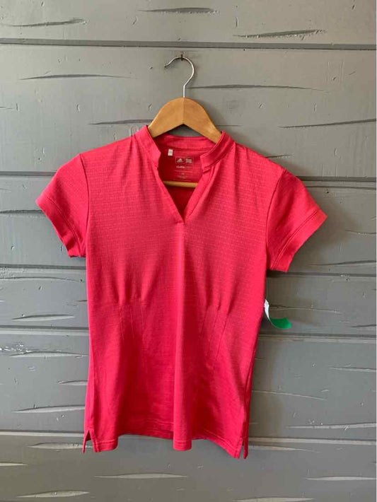 Women's solid red Adidas short-sleeve polo shirt size XS with subtle textured fabric.