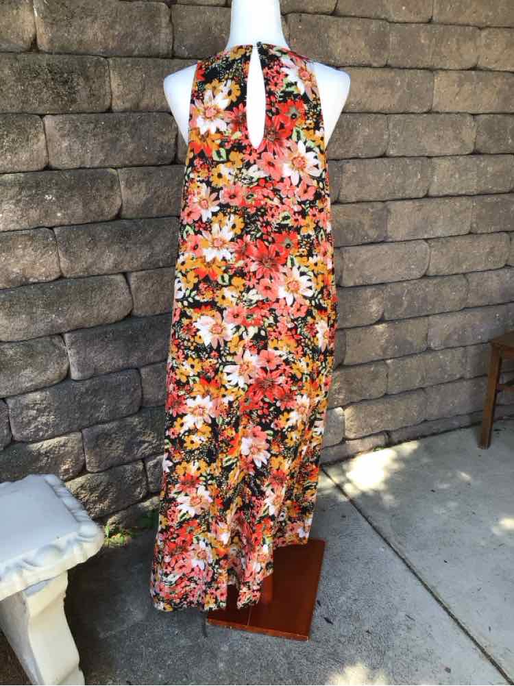 Sleeveless floral maxi dress in orange, pink, white, and black with keyhole neckline and flowy silhouette.