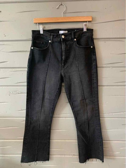 Black high-waisted straight-leg jeans with front and back pockets, button and zipper closure.