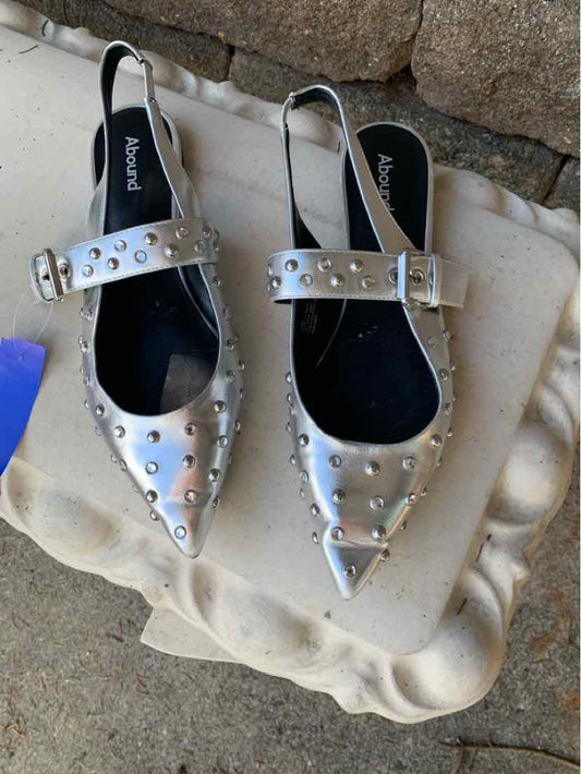 Silver studded slingback flats with pointed toe, perfect with denim jeans or casual tops.