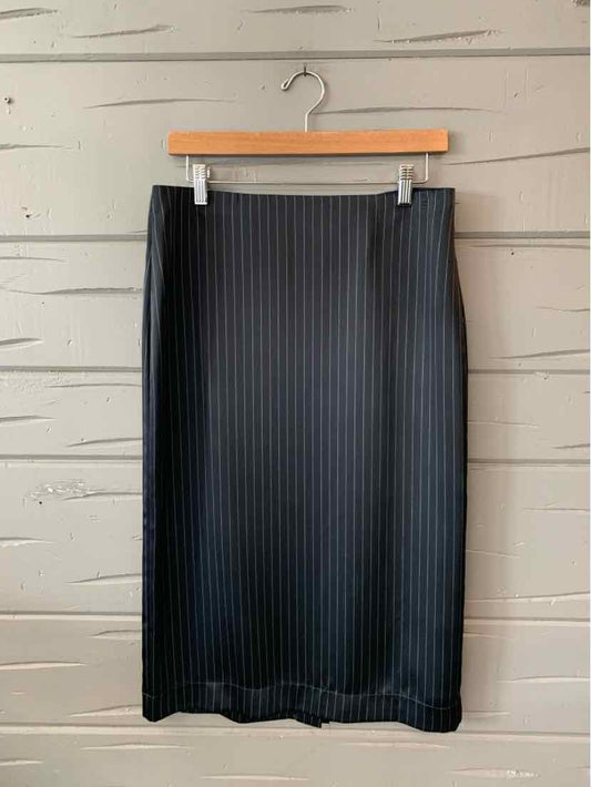 Black knee-length pencil skirt with vertical ribbed texture and fitted waistband.