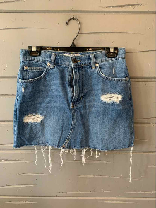 Light blue distressed denim mini skirt with frayed hem and front pockets.