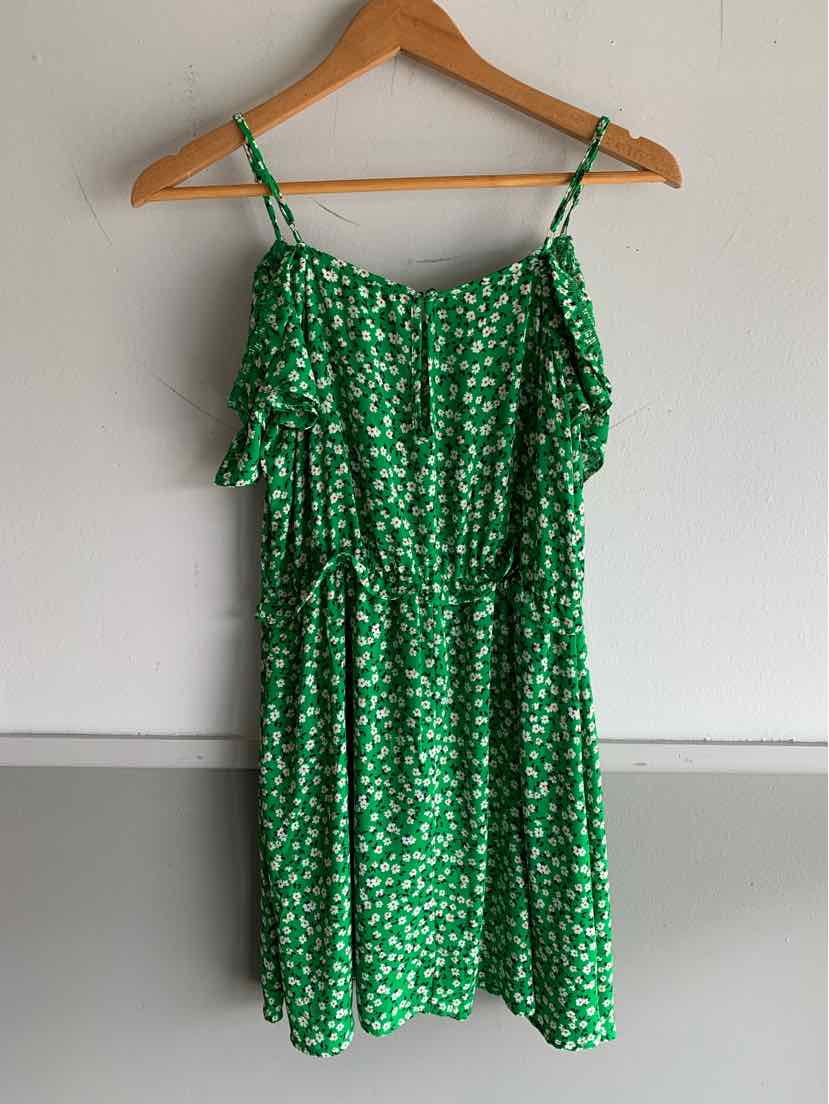 Green floral sleeveless dress with ruffle details and adjustable spaghetti straps.