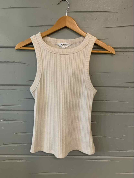 Cream ribbed sleeveless tank top with round neckline on wooden hanger.