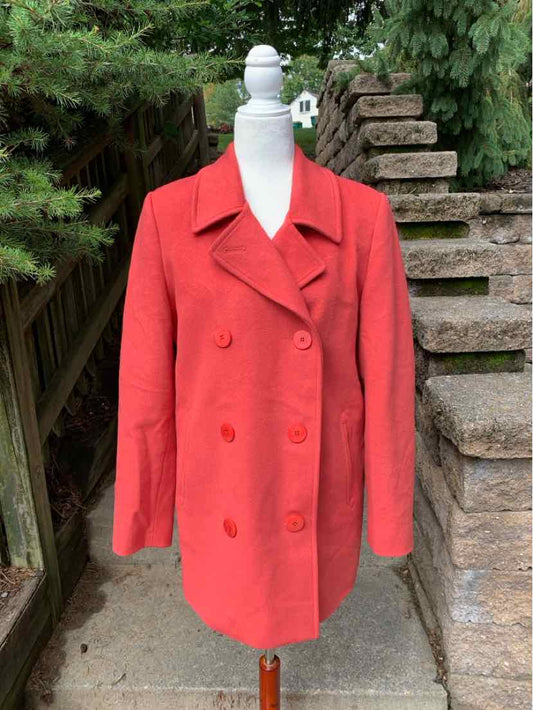 Women's solid red double-breasted pea coat with wide lapels and long sleeves.