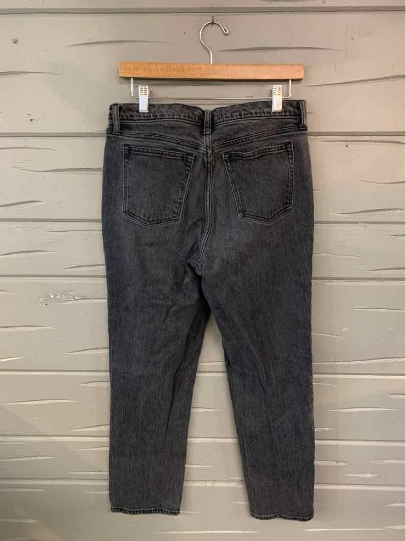 Dark gray high-waist straight-leg jeans with back pockets and belt loops hanging on wooden hanger.