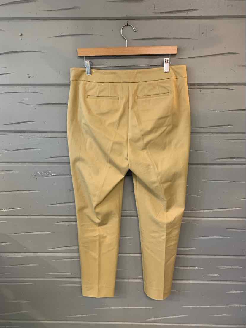 Tan tapered pants with front pockets, belt loops, and cropped ankle length in size 10P.