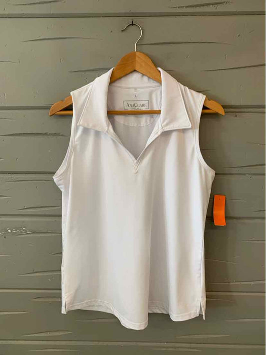 White sleeveless collared top with V-neck and relaxed fit on wooden hanger.