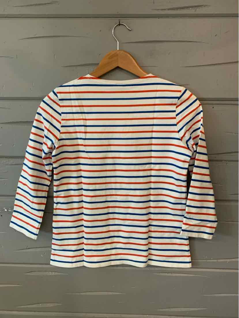 White long-sleeve shirt with thin horizontal stripes in red, blue, and black, crew neckline.