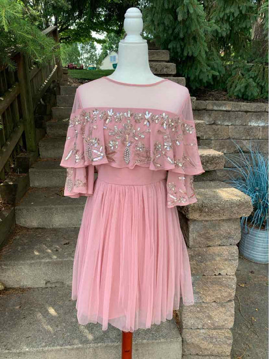 Pink off-shoulder dress with layered ruffled bodice adorned with bead embellishments and pleated skirt in size 8.