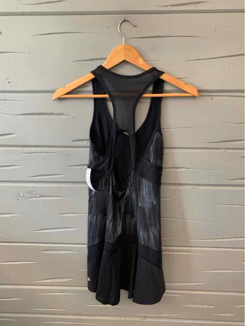 Black sleeveless athletic tank top with racerback design and lightweight mesh fabric.