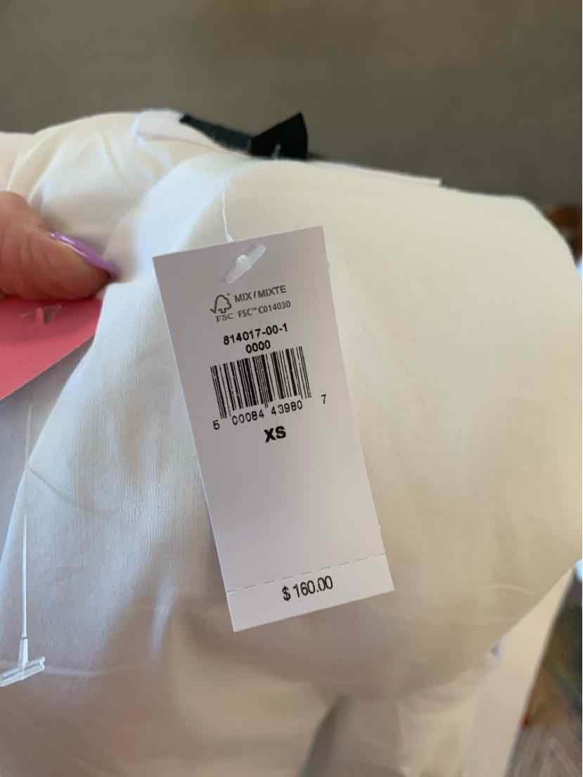 White linen Banana Republic shirt in size XS with price tag $182.00.