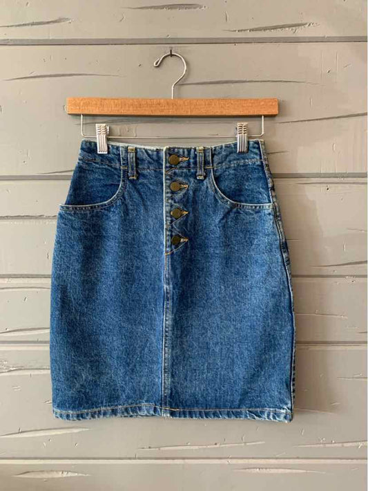 Blue denim skirt with front button closure and two front pockets, size 4.