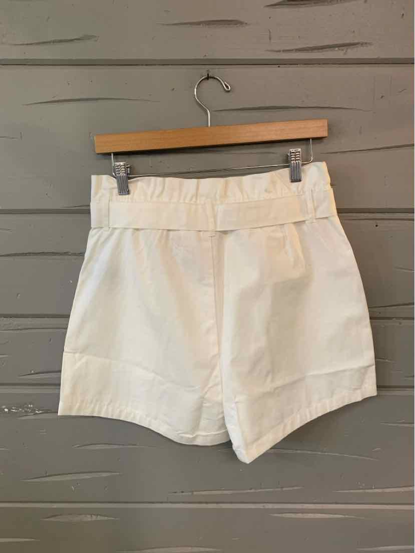 White high-waist shorts with wide waistband and belt loops, tailored fit, lightweight fabric.