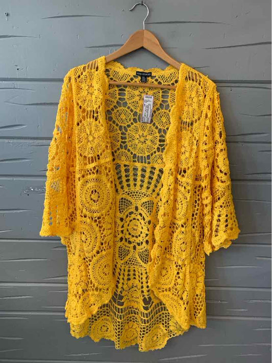 Yellow open-front crochet knit cardigan with floral circular patterns and 3/4 bell sleeves, size M/L.