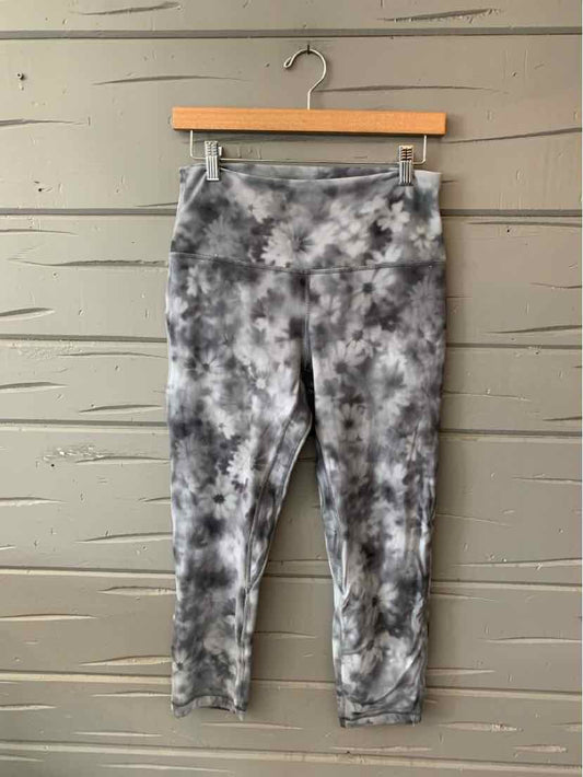 Gray and black tie-dye high-waisted cropped leggings with a fitted silhouette.