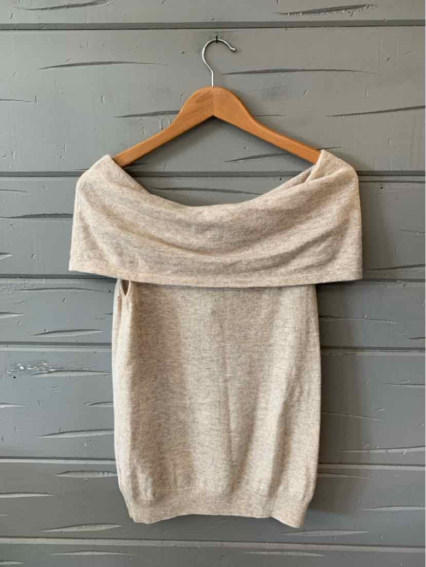 Beige wool off-shoulder sweater with wide folded neckline in large size on wooden hanger.