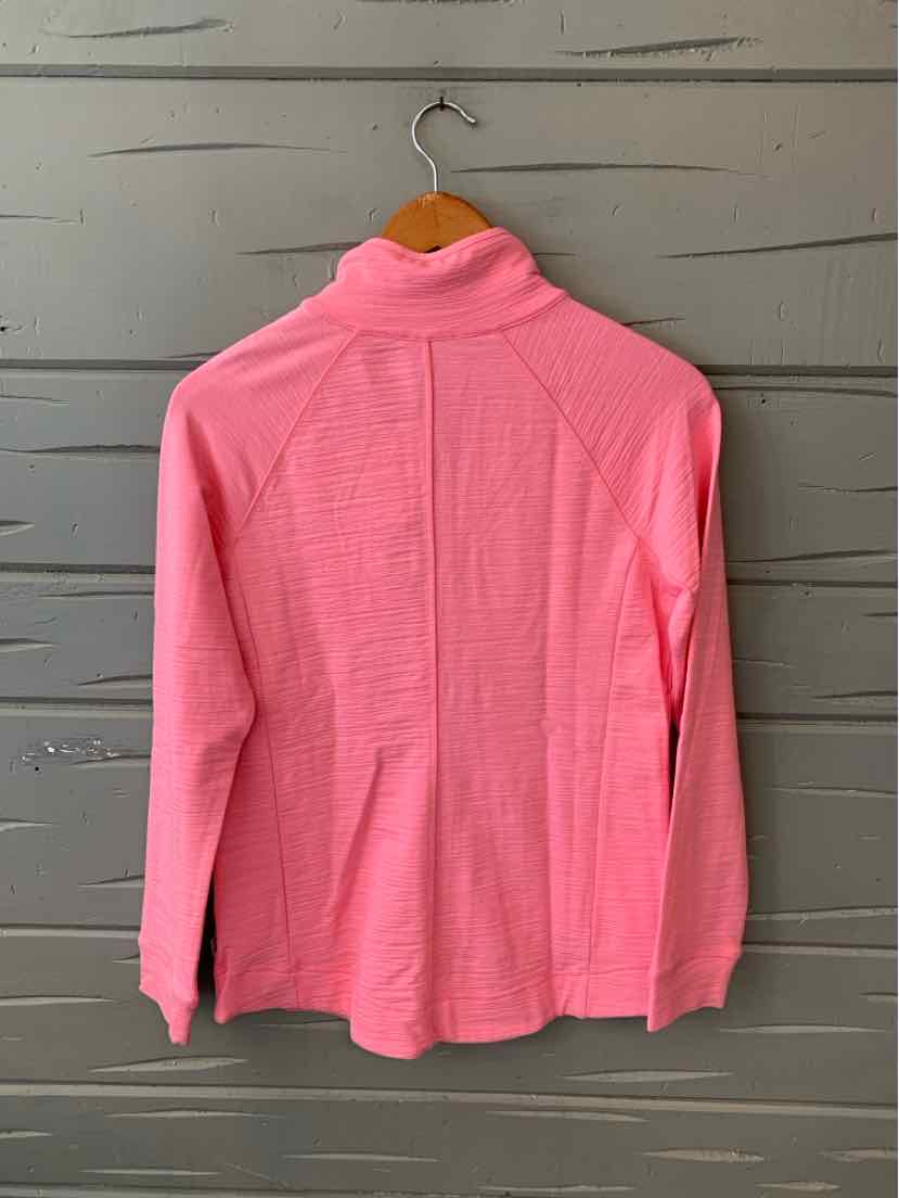 Light pink long-sleeve top with high collar and textured fabric hanging on wooden hanger.