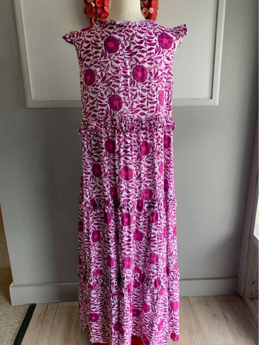 Pink and white floral sleeveless maxi dress with ruffle shoulder details and tiered skirt.