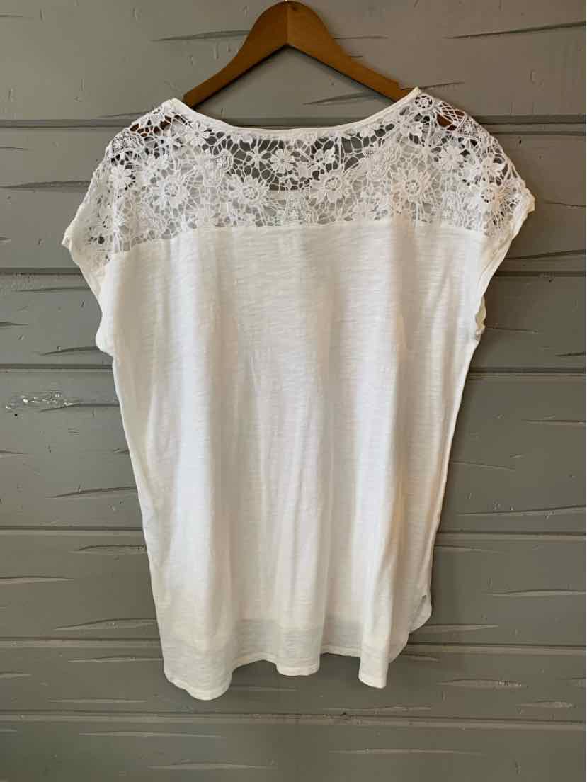 White short-sleeve blouse with lace yoke and relaxed fit, size medium.